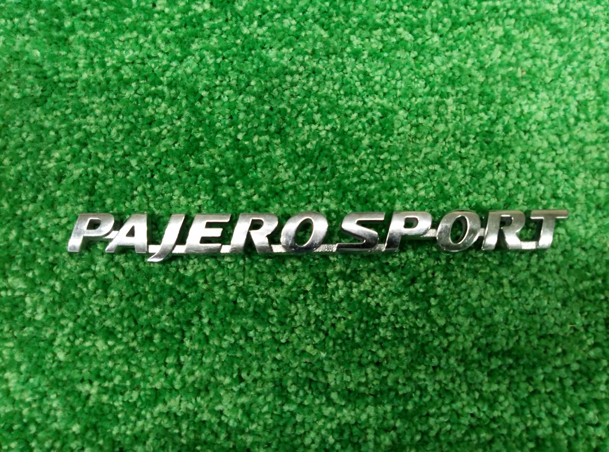 Эмблема на Mitsubishi Pajero Sport 2