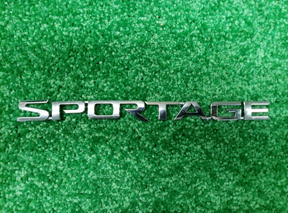 Эмблема на Kia Sportage 2